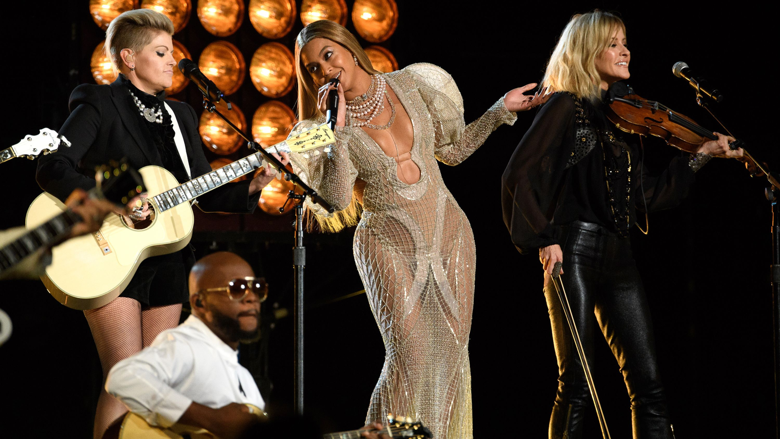 Beyoncé performs with The Chicks at the 2016 CMA Awards. 