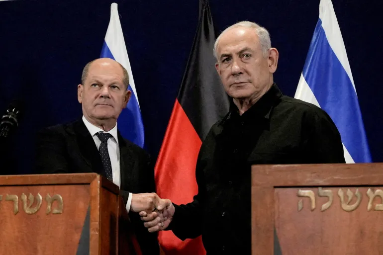 German Chancellor Olaf Scholz, left, holds a press conference with Israeli Prime Minister Benjamin Netanyahu during a visit to Tel Aviv [File: Maya Alleruzzo/Pool via Reuters]